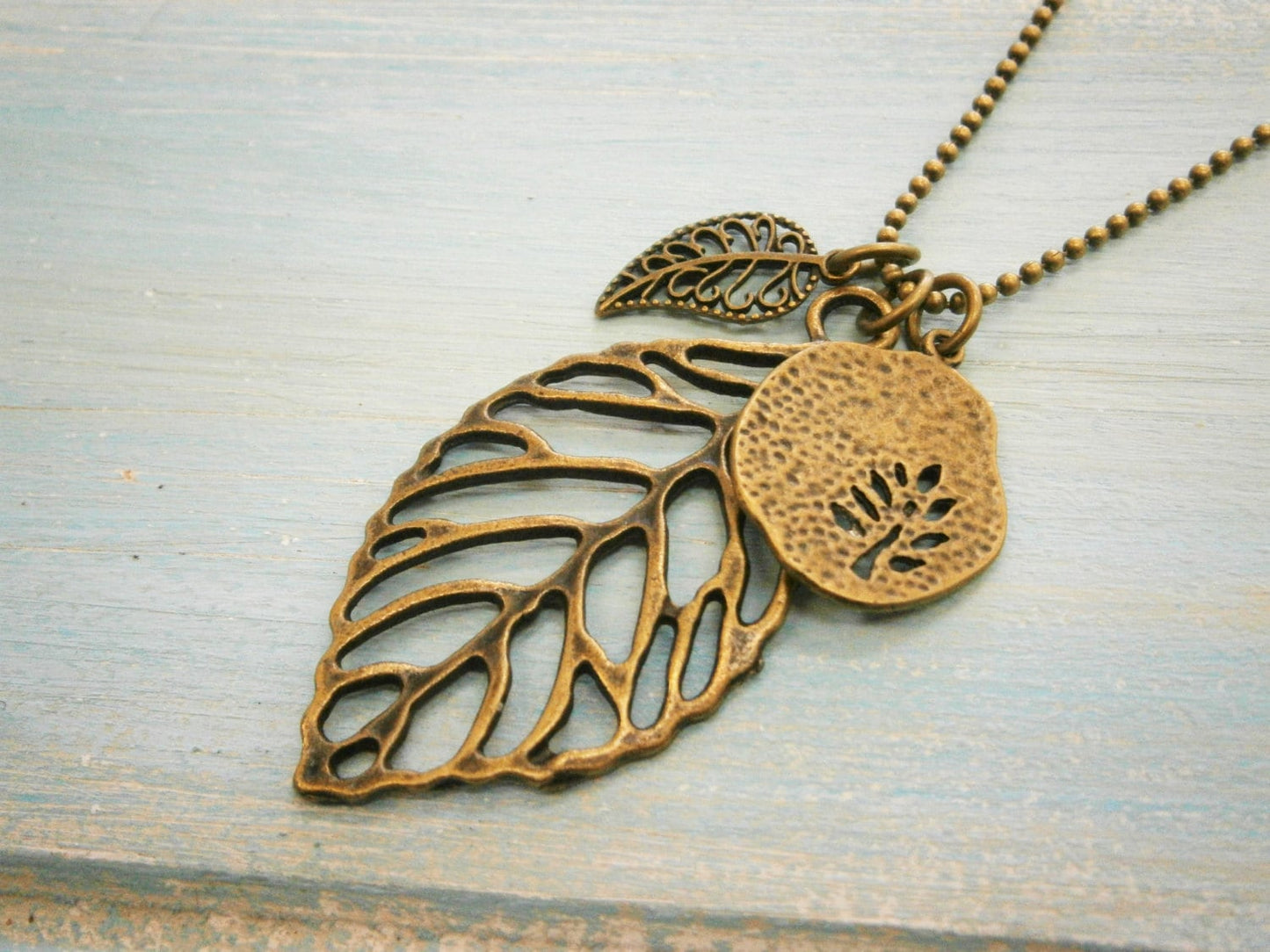 Antique Bronze Filigree Leaf Necklace with Small Filigree Leaf and Fossil Tree Charms/Boho Necklace.