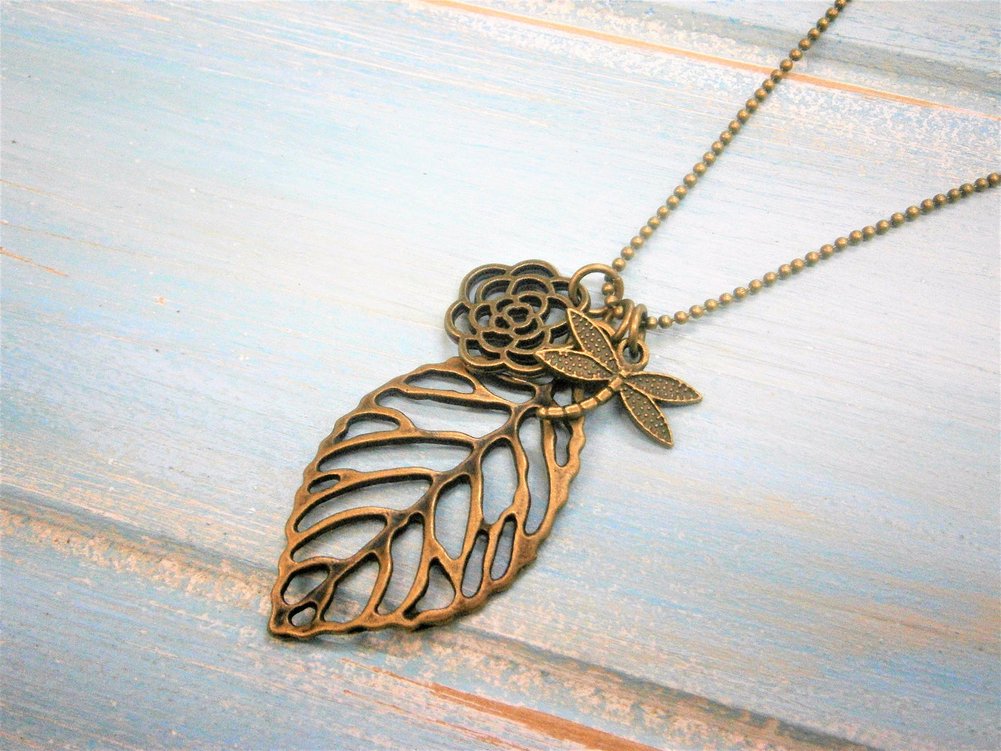 Antique Bronze Filigree Leaf Necklace with Filigree Flower and Small Dragonfly Charms/Boho Necklace/Woodland Jewelry/Nature Inspired