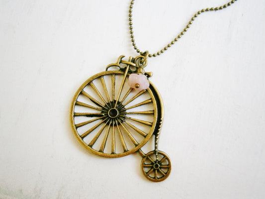 Antique Bronze Penny Farthing Bike Necklace with Pink Flower Bead Drop on Antique Bronze Ball Chain/Boho Necklace.